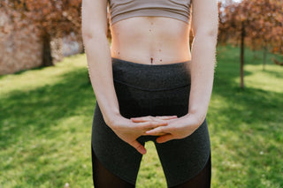 Arms and stomach of woman outside